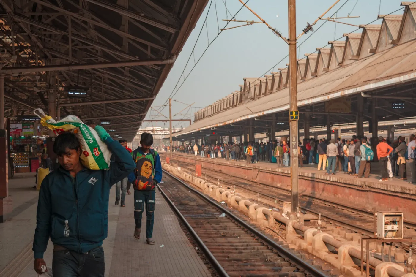Travelers waiting beside a train platform