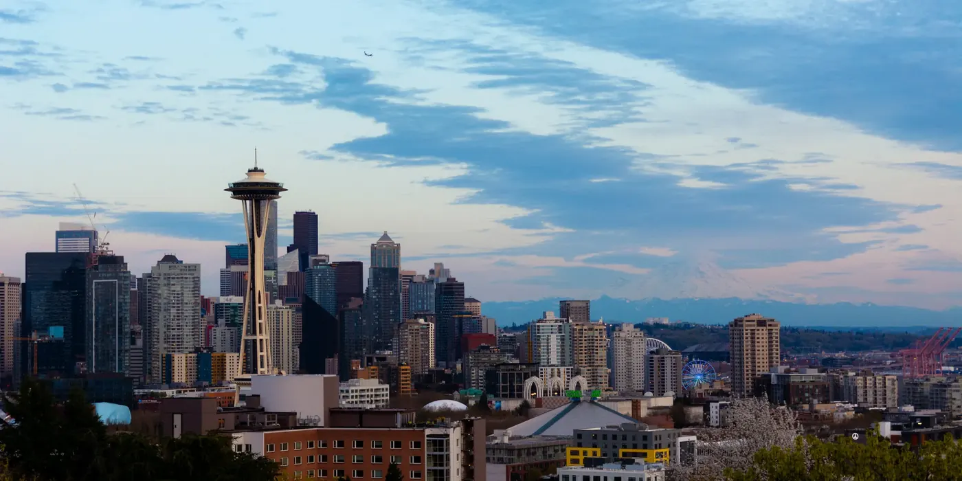 The Seattle skyline beneath a textured evening sky
