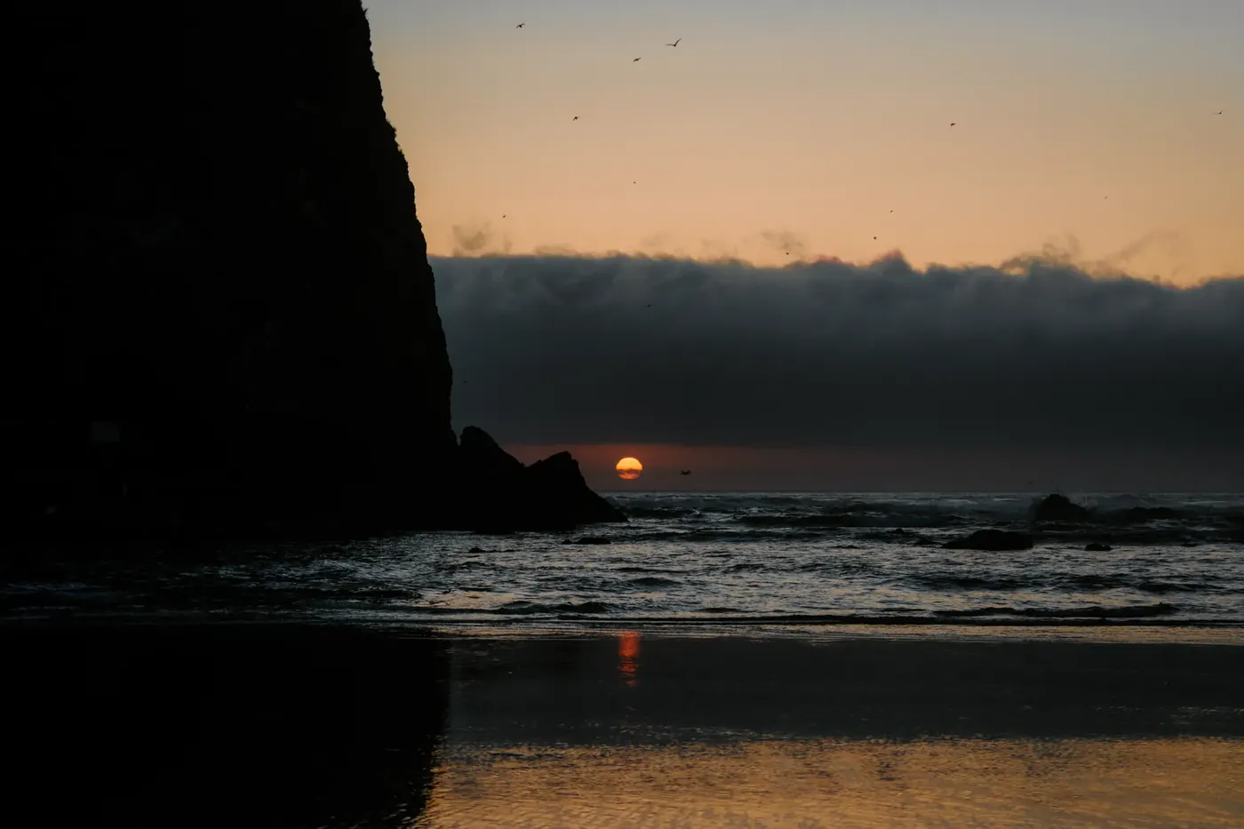 The last point of sunlight between ocean and cloud
